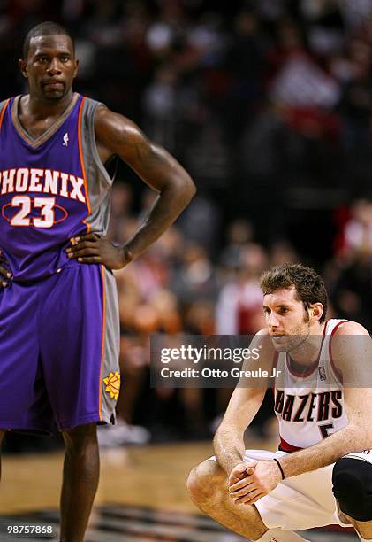 Rudy Fernandez of the Portland Trail Blazers crouches near the end of the game as Jason Richardson of the Phoenix Suns looks on during Game Six of...