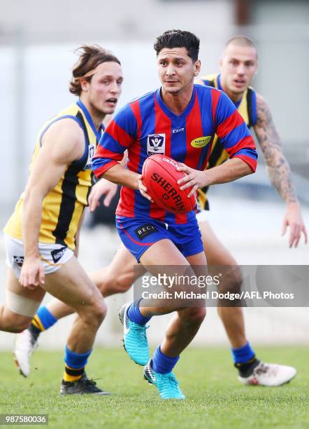 Robin Nahas of Port Melbourne runs with the ball during the round 13 VFL match between Port Melbourne and Sandringham at North Port Oval on June 30,...