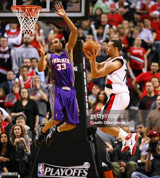 Brandon Roy of the Portland Trail Blazers passes against Grant Hill of the Phoenix Suns during Game Six of the Western Conference Quarterfinals of...