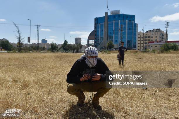 Palestinian protesters and Israeli forces clash on the outskirts of Ramallah near the Israeli-Settlement of Beit-El. Palestinian protesters and...