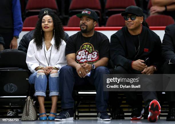 Kimberly Woodruff, league Co-Founder Ice Cube and LL Cool J watch the action during week two of the BIG3 three on three basketball league at United...