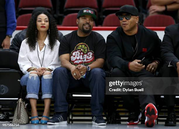 Kimberly Woodruff, league Co-Founder Ice Cube and LL Cool J watch the action during week two of the BIG3 three on three basketball league at United...