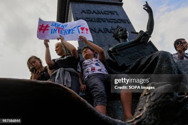 Youngsters hold a banner saying "Free internet" during a protest against the implementation of ACTA 2 in European Union. On June 20th, The Legal...