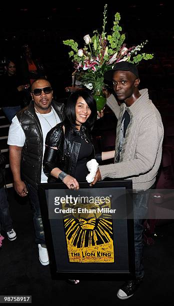 Recording artist Timbaland, his wife Monique Mosley and cast member Kyle Banks appear with flowers and an autographed poster presented to Mosley for...