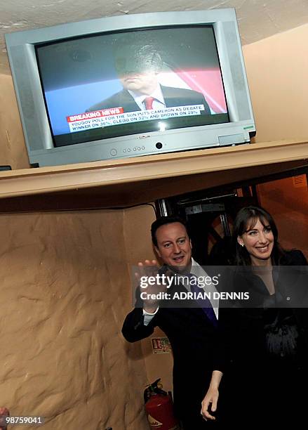 Conservative Party Leader David Cameron and his wife Samantha wave to supporters as they arrive at the Three Suga Loaves pub following the second...