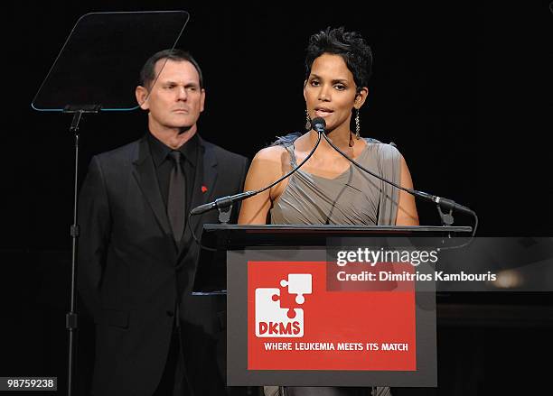 Halle Berry and CEO of Coty Inc. Bernd Beetz speak at the DKMS' 4th Annual Gala: Linked Against Leukemia at Cipriani 42nd Street on April 29, 2010 in...