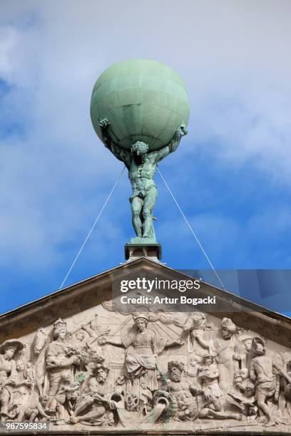 atlas carrying the globe statue - atlas statue stock pictures, royalty-free photos & images