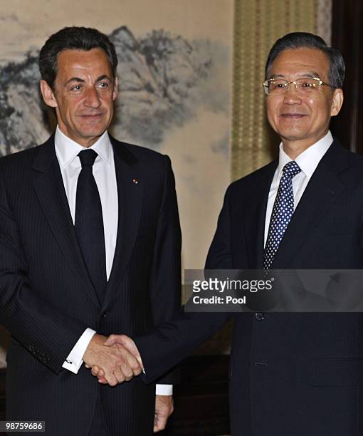 French President Nicolas Sarkozy shakes hands with Chinese Prime Ministe Wen Jiabao at the Zhongnanhai leadership compound on April 30, 2010 in...
