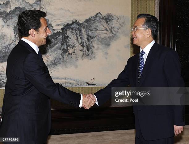 French President Nicolas Sarkozy shakes hands with Chinese Prime Ministe Wen Jiabao at the Zhongnanhai leadership compound on April 30, 2010 in...