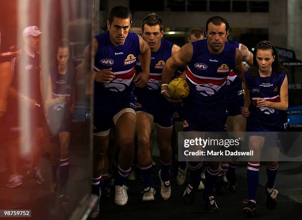 Daniel Giansiracusa and Brad Johnson of the Bulldogs lead the team out for the round six AFL match between the Western Bulldogs and the St Kilda...