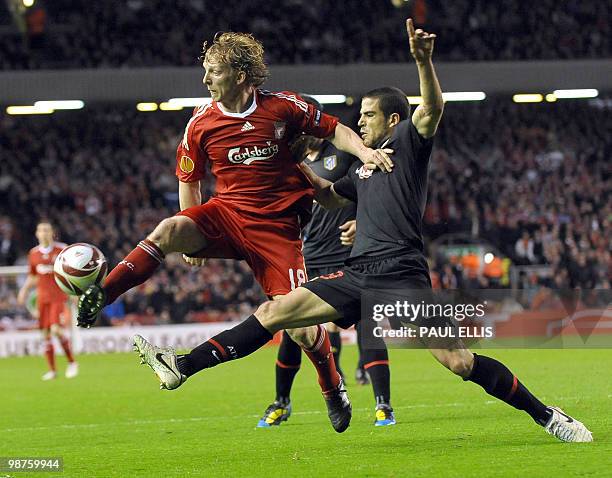 Liverpool's Dutch forward Dirk Kuyt vies with Atletico Madrid's midfielder Raul Garcia during their UEFA Europa League Semi Final second leg football...