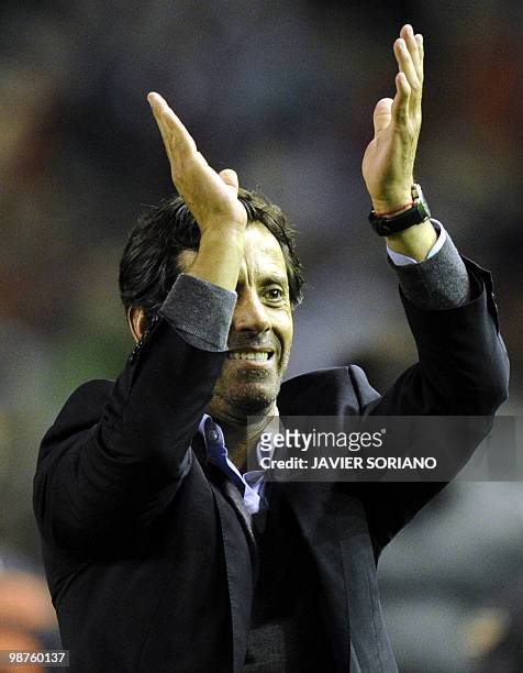 Atletico Madrid's coach Quique Sanchez Flores celebrates at the final whistle after his team had knocked out Liverpool on away goals during their...