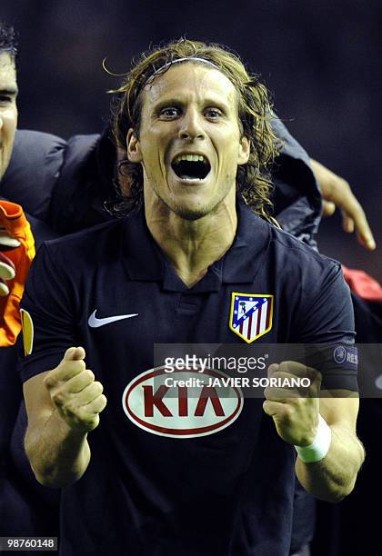 Atletico Madrid's Uruguayan forward Diego Forlan jubilates at the final whistle after his goal had knocked out Liverpool on away goals during their...