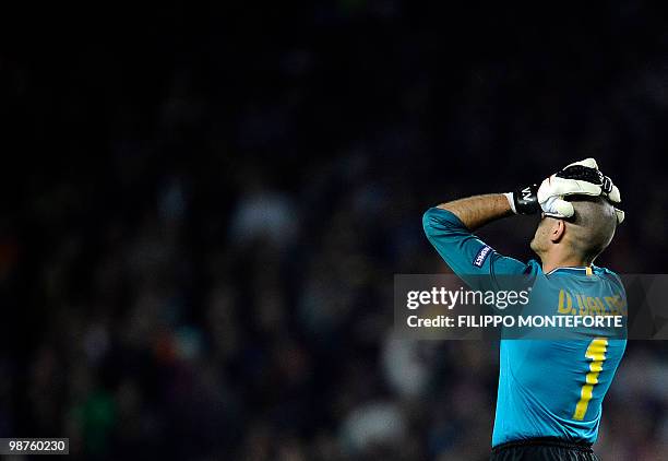 Barcelona's goalkeeper Victor Valdes reacts after the UEFA Champions League semi-final second leg football match Barcelona vs Inter Milan on April...