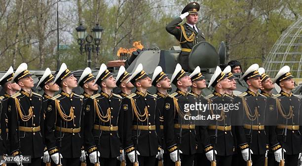 Russian honour guards particpate in a ceremony to light the "Eternal Flame of Memory and Glory" at Victory Park in Moscow on April 30, 2010. In the...