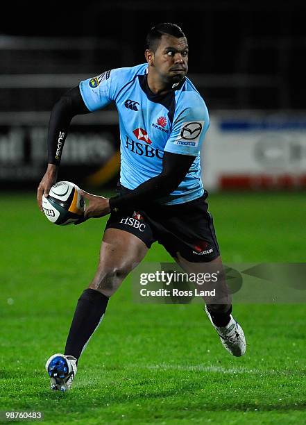 Kurtley Beale of the Waratahs breaks through the defence during the round 12 Super 14 match between the Highlanders and the Waratahs on April 30,...