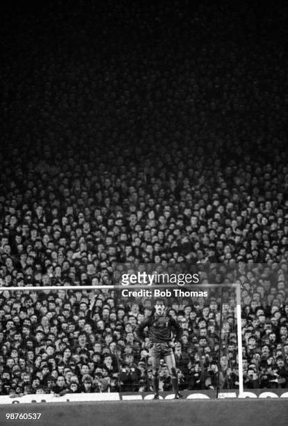 Liverpool goalkeeper Bruce Grobbelaar stands alone in front of a packed Anfield Kop after being beaten by Miroslaw Tlokinski of Widzew Lodz from the...