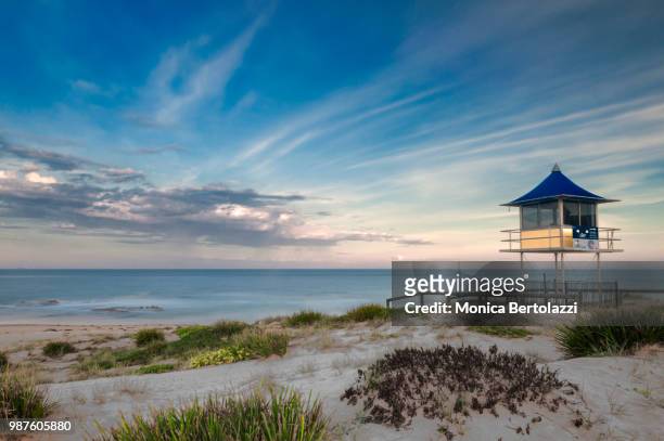 a lifeguard tower at sunset - bertolazzi stock-fotos und bilder