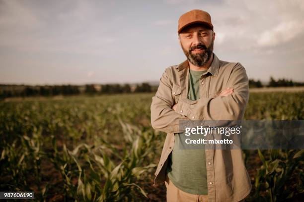 farmer on his field - farmer portrait stock pictures, royalty-free photos & images