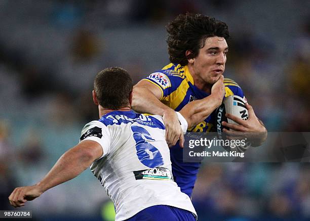 Joel Reddy of the Eels tries to get past Blake Green of the Bulldogs during the round eight NRL match between the Parramatta Eels and the...