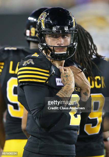 Johnny Manziel of the Hamilton Tiger-Cats patrols the sideline during action against the Winnipeg Blue Bombers in a CFL game at Tim Hortons Field on...