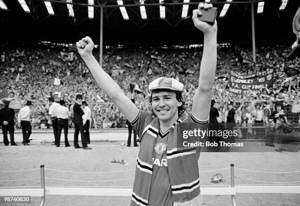 Manchester United captain Bryan Robson clutches his winner's medal during the lap of honour after his team's victory over Everton in the FA Cup Final...