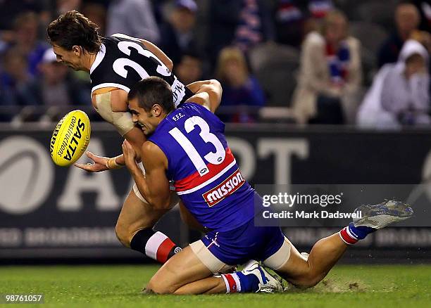 Daniel Giansiracusa of the Bulldogs runs down Justin Koschitzke of the Saints during the round six AFL match between the Western Bulldogs and the St...