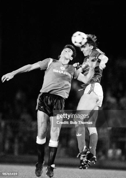 Irvin Gernon of Ipswich Town out-jumps Frank Stapleton of Manchester United during the Division One football match held at Portman Road, Ipswich on...