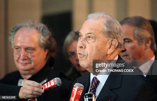 Former French Interior minister Charles Pasqua answers to journalists' questions at the Paris courthouse on April 30 after he received one year...