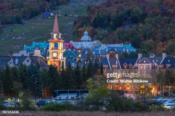 quebec, the laurentians, mont tremblant, ski village, dusk - mont tremblant ski village stock pictures, royalty-free photos & images