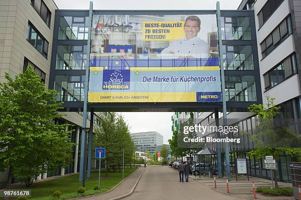 Giant advertisement banner hangs at the headquarters of Metro AG in Duesseldorf, Germany, on Friday, April 30, 2010. Metro AG, Germany's largest...