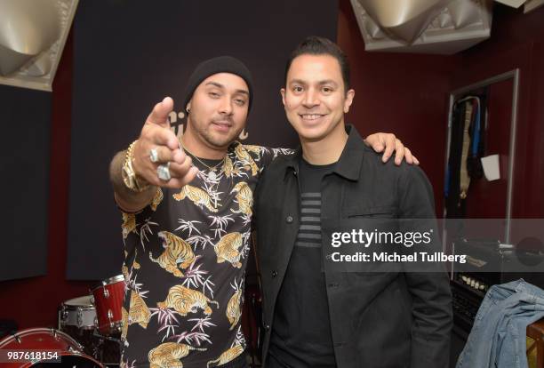 Music artist Osmar Escobar and music publisher Joseph Gonzalez attend a release party for his EP "La Cultura" at Gibson Brand Showroom on June 29,...