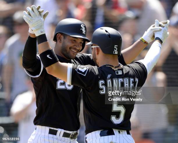 Jose Rondon celebrates with Yolmer Sanchez of the Chicago White Sox during the game against the Baltimore Orioles on May 21, 2018 at Guaranteed Rate...