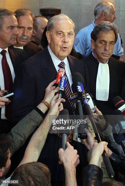 Former French Interior minister Charles Pasqua addresses journalists at the Paris courthouse on April 30 after he received one year suspended prison...