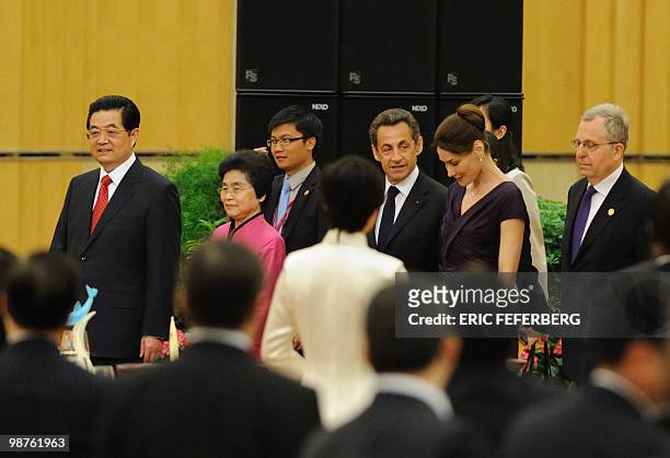 Chinese President Hu Jintao , his wife Liu Yongqing , French President Nicolas Sarkozy and his wife Carla Bruni-Sarkozy arrive at the official...