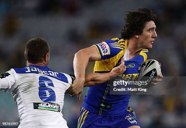 Joel Reddy of the Eels tries to get past Blake Green of the Bulldogs during the round eight NRL match between the Parramatta Eels and the...