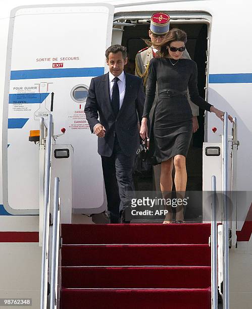 French President Nicolas Sarkozy and his wife Carla Bruni-Sarkozy arrive at the Shanghai airport, on April 30, 2010. Shanghai is to kick off the...