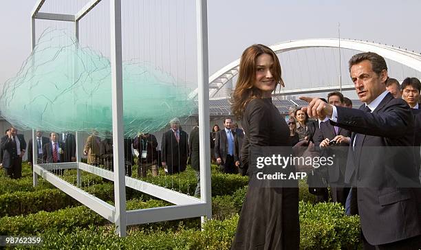French President Nicolas Sarkozy and his wife Carla Bruni-Sarkozy walk in the French pavilion, during a visit at the Shanghai World Expo site in...