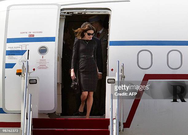France's President Nicolas Sarkozy's wife Carla Bruni-Sarkozy arrives at the Shanghai airport, on April 30, 2010. Shanghai is to kick off the World...