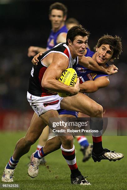 Lenny Hayes of the Saints is tackled by Ryan Griffen of the Bulldogs during the round six AFL match between the Western Bulldogs and the St Kilda...
