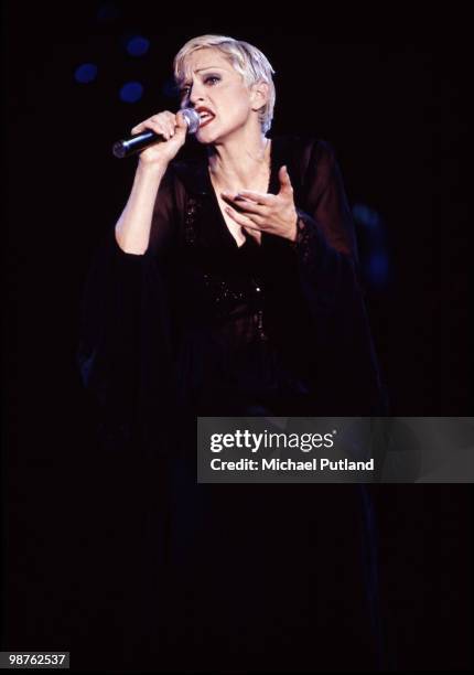 American singer Madonna performing on stage at Wembley Stadium, London, during her 'Girlie Show' world tour, September 1993.