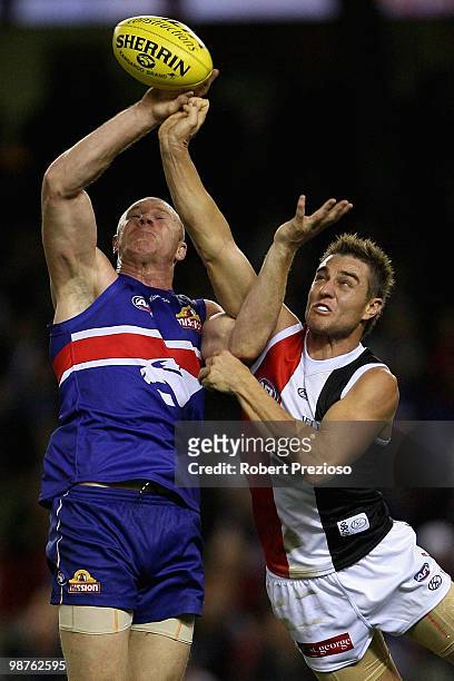 Sam Fisher of the Saints spoils Barry Hall of the Bulldogs during the round six AFL match between the Western Bulldogs and the St Kilda Saints at...