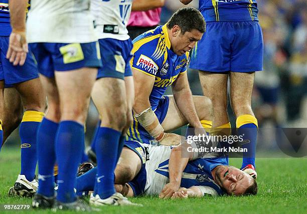 Nathan Cayless of the Eels assists Blake Green of the Bulldogs during the round eight NRL match between the Parramatta Eels and the...