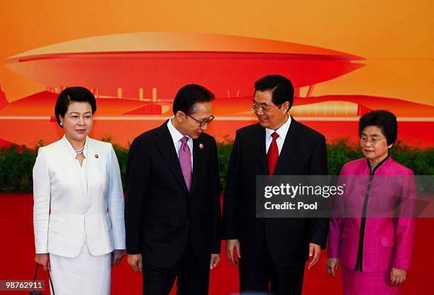 Chinese President Hu Jintao, , his wife Liu Yongqing, , Korean President Lee Myung-bak, , and wife Kim Yoon-ok, , stand for a group photo at a...