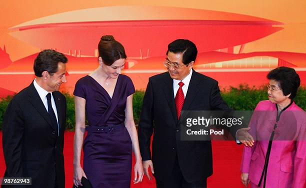 French President Nicolas Sarkozy and his wife Carla Bruni-Sarkozy with Chinese President Hu Jintao, and his wife Liu Yongqing stand for photos during...