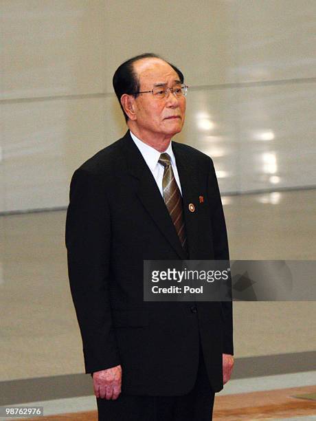Kim Yong Nam, President of the Presidium of the North Korea's Supreme People's Assembly, stands waiting to shake hands with Chinese President Hu...