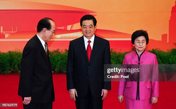 Kim Yong Nam, President of the Presidium of the North Korea's Supreme People's Assembly, stands with Chinese President Hu Jintao and his wife Liu...