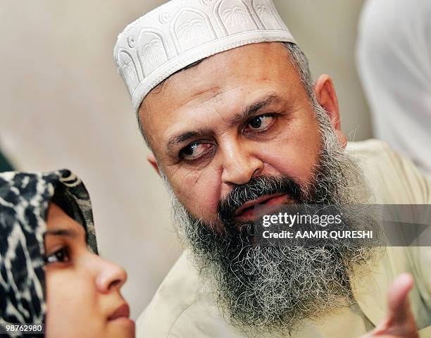 In this picture taken on June 25 Pakistani Khalid Khawaja Chief Coordinator of Defence of Human Rights sits with his daughter Rabia Khalid as he...