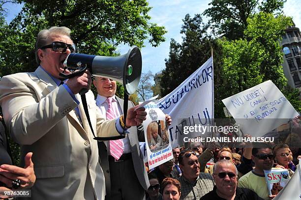 Romanian Euro Parliamentarian Corneliu Vadim Tudor adresses animal rights activists during a protest against local authorities of Bucharest on April...