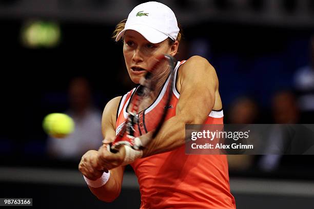 Samantha Stosur of Australia plays a backhand during her quarterfinal match against Na Li of China at day five of the WTA Porsche Tennis Grand Prix...